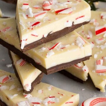 Multiple pieces of peppermint bark stacked on top of each other.