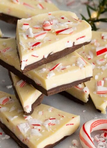 Multiple pieces of peppermint bark stacked on top of each other.