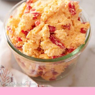Pinterest graphic of a glass jar with pimento cheese.