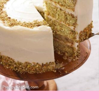 Pinterest graphic of a slice of pistachio cake cut and lifted from the cake on the cake stand.