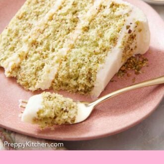 Pinterest graphic of a plate with a slice of pistachio cake with a forkful in front.