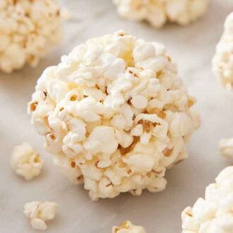 Popcorn balls on a marble surface.