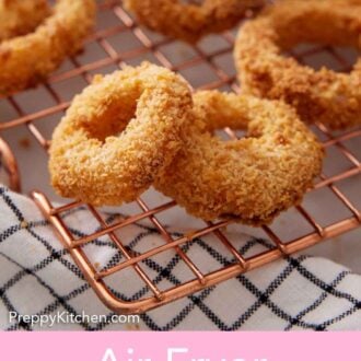 Pinterest graphic of air fryer onion rings on a copper cooling rack.