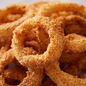 A close up view of air fryer onion rings.