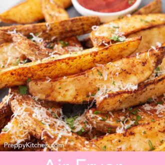 Pinterest graphic of a close view of air fryer potato wedge topped with freshly grated parmesan and parsley.
