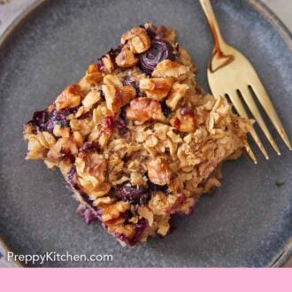 Pinterest graphic of an overhead view of a plate with a square piece of baked oatmeal with a fork beside it.