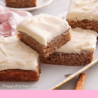 Pinterest graphic of a small pile of banana bars on a platter.