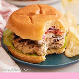 Pinterest graphic of a plate with a chicken burger with a bite taken out.