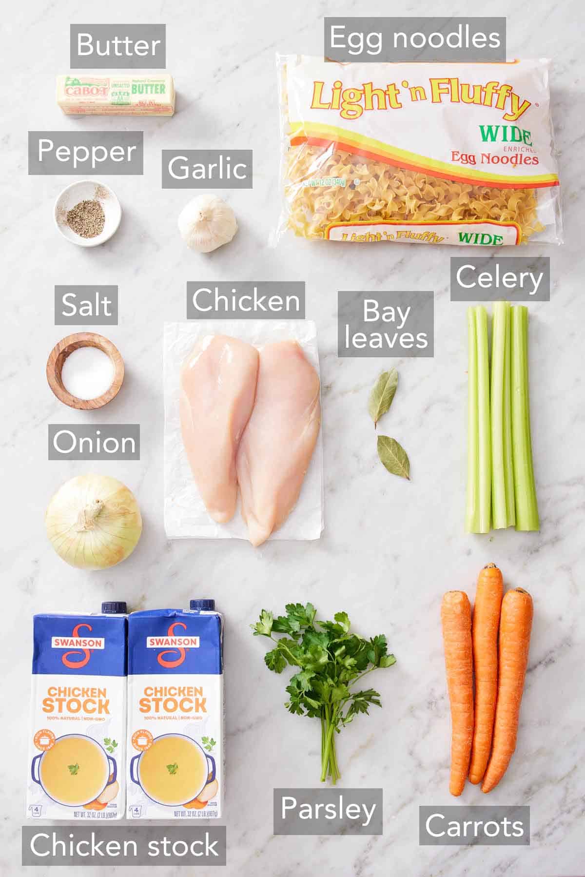 Ingredients needed to make chicken noodle soup.