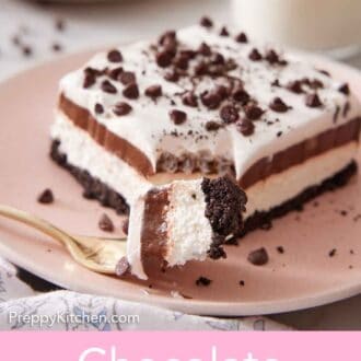 Pinterest graphic of a plate with a slice of chocolate lasagna with a fork in front with the corner bite on it.