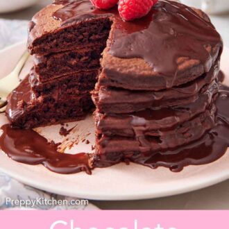 Pinterest graphic of a stack of chocolate pancakes topped with chocolate sauce and raspberries with a portion cut out.