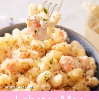 Pinterest graphic of a fork lifting up a bite of lobster mac and cheese from a bowl.