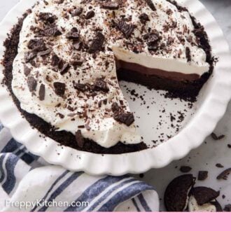 Pinterest graphic of a mud pie in a white baking dish with a slice taken out.