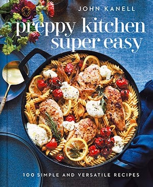 A photo of the cover of Preppy Kitchen Super Easy with a pan of delicious pasta on a blue tablecloth.