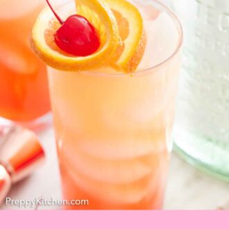 Pinterest graphic of a glass of tequila sunrise with orange slice and maraschino cherry garnish.