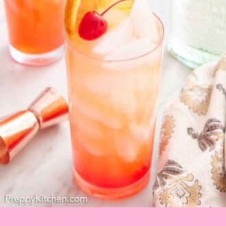 Pinterest graphic of a tall glass of tequila sunrise with orange slice and maraschino cherry garnish. A jigger, linen napkin, bottle of tequila, and second cocktail off to the side.