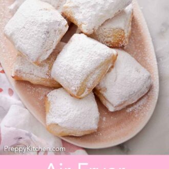 Pinterest graphic of a platter of air fryer beignets with a dusting of powder sugar on top.
