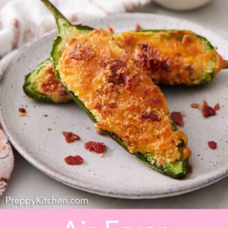 Pinterest graphic of two air fryer jalapeno poppers on a plate with bacon crumbles scattered around.