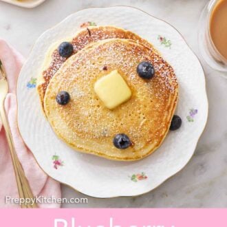 Pinterest graphic of an overhead view of a stack of blueberry pancakes with blueberries, butter on top with a dusting of powdered sugar.
