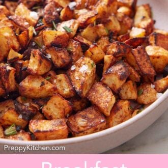 Pinterest graphic of a close up view of a plate of breakfast potatoes topped with flaky salt and chopped rosemary.