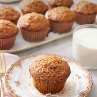 Pinterest graphic of a plate with a carrot muffin with a glass of milk off to the side and a platter with more carrot muffins.