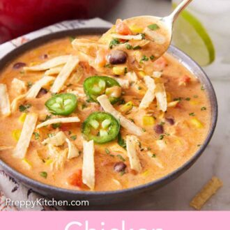 Pinterest graphic of a spoonful of chicken enchilada soup lifted from a bowl.