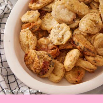 Pinterest graphic of a platter of fried pickles with a bowl of sauce in the background.