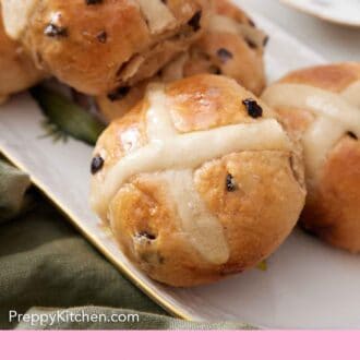 Pinterest graphic of a platter of hot cross buns.