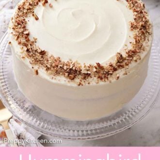 Pinterest graphic of a clear cake stand with a hummingbird cake topped with chopped pecans.