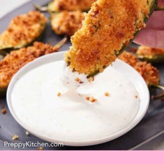 Pinterest graphic of a jalapeno popper dipped into a creamy dipping sauce.