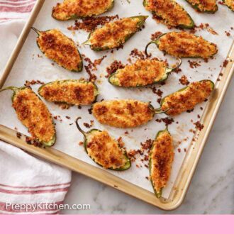 Pinterest graphic of a lined sheet pan with multiple baked jalapeno poppers.