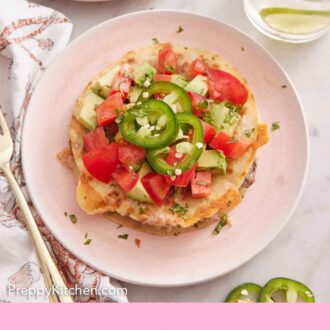 Pinterest graphic of an overhead view of a plate of mulita topped with jalapenos, tomatoes, and avocados.