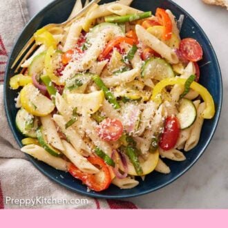 Pinterest graphic of overhead view of a bowl of pasta primavera with a fork inside.