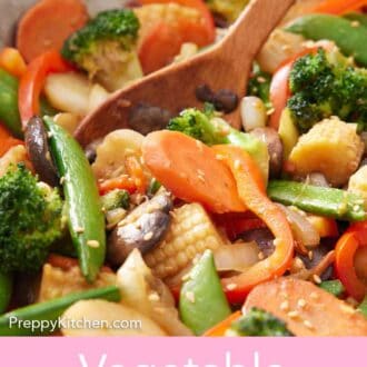 Pinterest graphic of close view of a wooden spoon in vegetable stir fry.