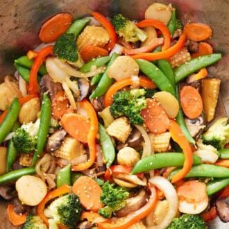An overhead view of a wok of vegetable stir fry.