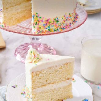 Pinterest graphic of a slice of white cake on a plate with the rest of the cake in the background on a cake stand.