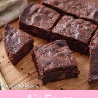 Pinterest graphic of air fryer brownies on a wooden serving board.