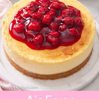 Pinterest graphic of an air fryer cheesecake with cherry sauce on top.