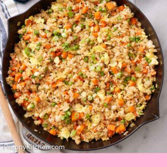 Pinterest graphic of a skillet of fried rice with a stack of bowls, forks, and bowls of garnishes on the side.