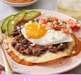 Pinterest graphic of a profile view of huevos rancheros on a plate, showing the layers of sauce, tortilla, and toppings.