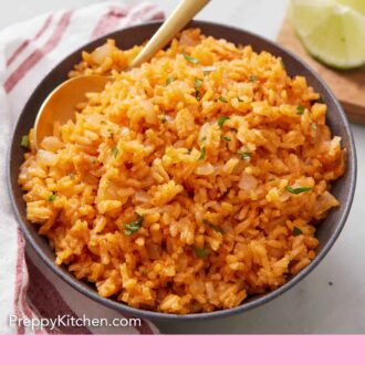 Pinterest graphic of a bowl of Mexican rice with a spoon inside.