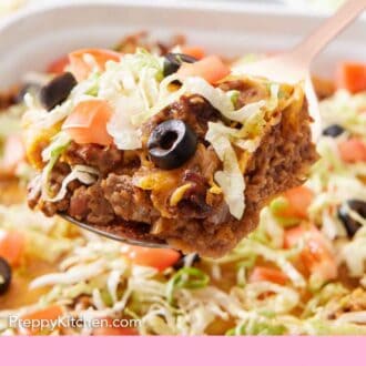 Pinterest graphic of a slice of taco casserole lifted from a baking dish.