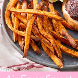 Pinterest graphic of a plate with air fryer sweet potato fries with an opened burger beside it.