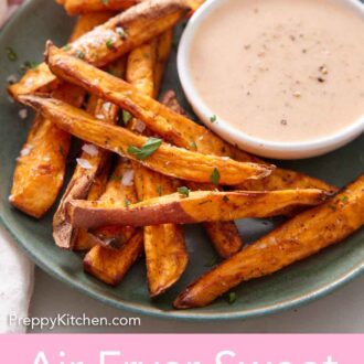 Pinterest graphic of a green plate with air fryer sweet potato fries with a bowl of dip.