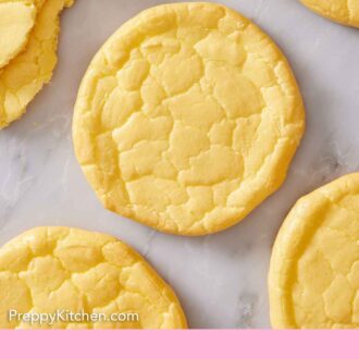 Pinterest graphic of an overhead view of cloud bread on a marble counter.