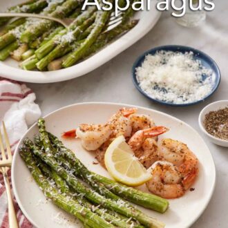 Pinterest graphic of a plate of shrimp with air fryer asparagus and a lemon wedge. A platter of more air fryer asparagus in the back along with a bowl of parmesan.