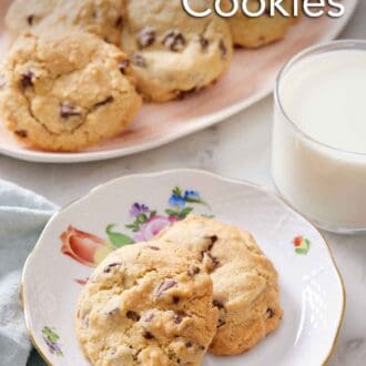 Pinterest graphic of a plate with two air fryer cookies with a glass of milk and a platter of more cookies in the back.