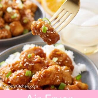 Pinterest graphic of a fork lifting up a piece of air fryer orange chicken.