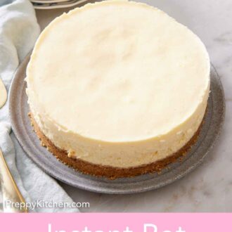 Pinterest graphic of a plate with an Instant Pot cheesecake. Stack of plates and forks in the back.