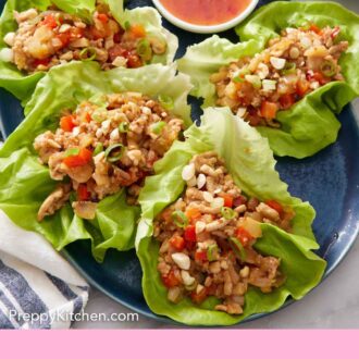 Pinterest graphic of a platter of lettuce wraps with a sweet chili sauce in a bowl along with lime wedges.